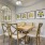 Model dining room at our 55 and over apartments for rent in Hamilton County, IN, featuring a dining room table.