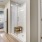 The entryway to one of our senior living apartments in Noblesville, IN, featuring a view of the bedroom and walk in closet.
