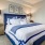 a bedroom with a bed and lamps