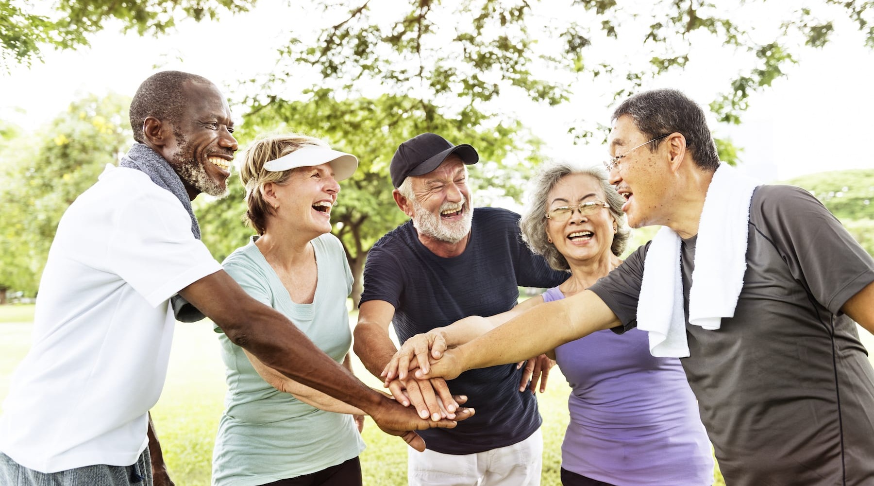 LIVE YOUR BEST LIFE AT OUTLOOK HAMILTON a group outdoors in workout attire