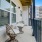 Model balcony at one of our senior apartments for rent in Noblesville, IN, featuring two seats and a small table.