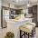 Model kitchen at our 55 and over apartments for rent in Noblesville, IN, featuring wood grain floor paneling.