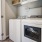 a kitchen with white appliances
