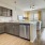 Model kitchen at our 55 and over apartments for rent in Noblesville, IN, featuring wood grain floor paneling.